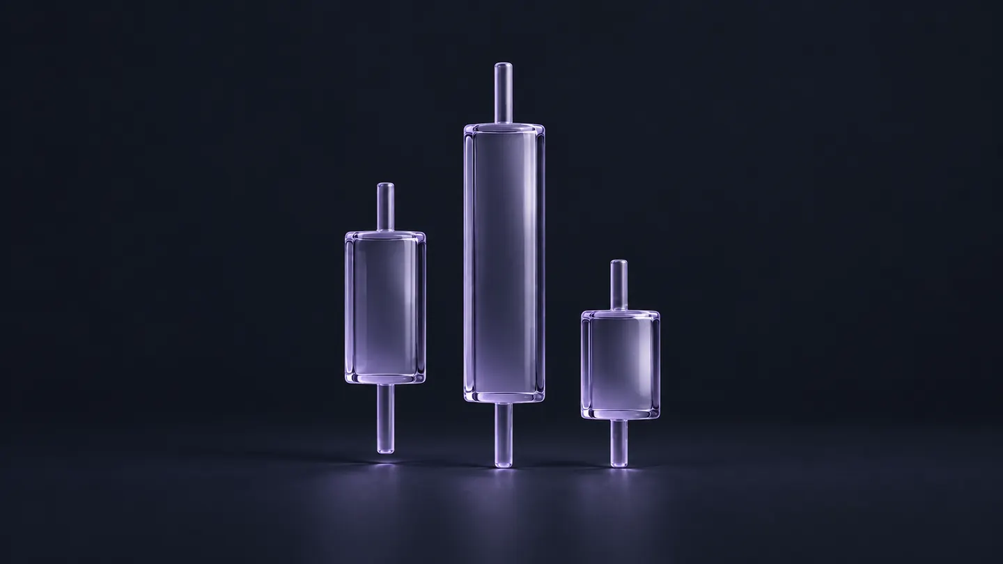 Three lavender glass candlesticks of different heights.